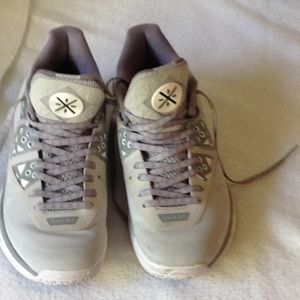 Nearly new athletic shoes in light silver gray